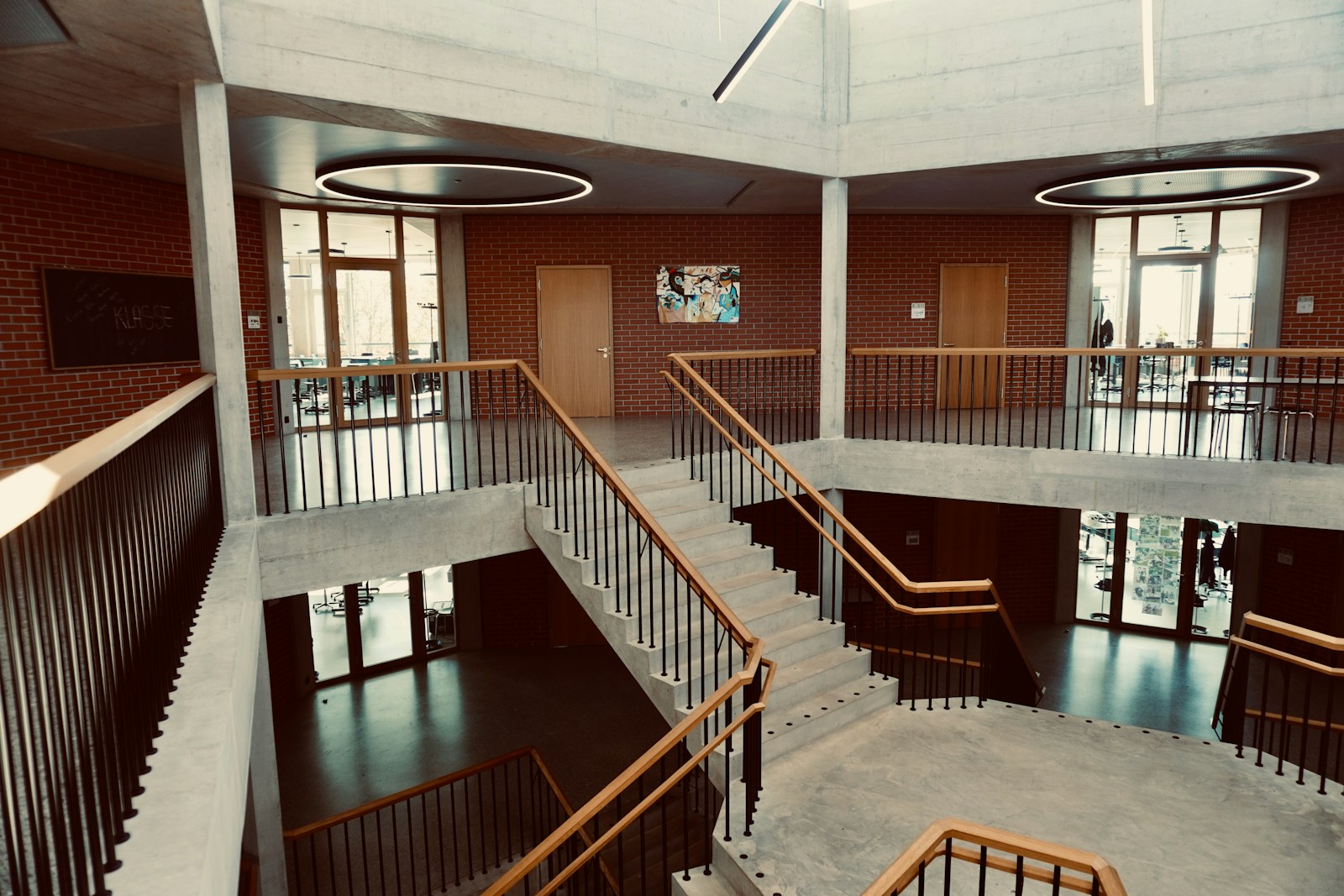 a spiral staircase in a building with brick walls